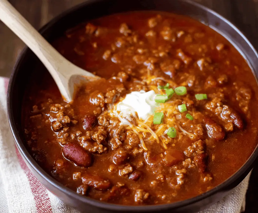 Delicious homemade Copycat Wendy's Chili in a bowl, featuring ground beef, beans, and savory spices perfect for a hearty meal