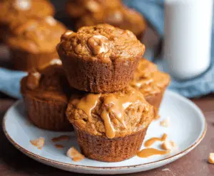 Delicious homemade pumpkin butterscotch muffins with a golden top and gooey butterscotch chips, perfect for fall baking.