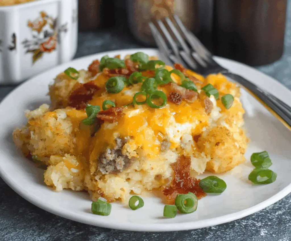 Delicious Crockpot Tater Tot Breakfast Casserole with melted cheese and crispy bacon on top.