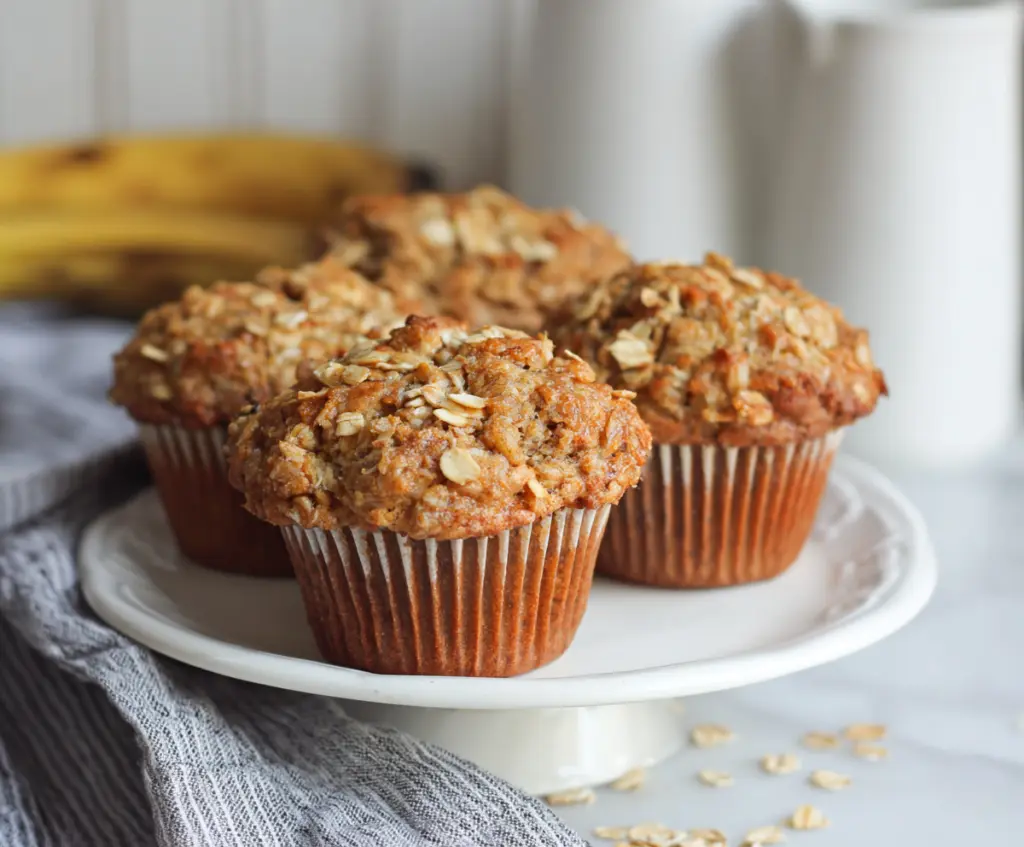 Delicious homemade Banana Oat Muffins on a plate, perfect for a healthy breakfast or snack.