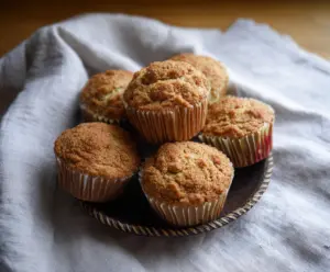 Delicious Apple Cinnamon Sourdough Muffins fresh out of the oven, showcasing a golden-brown crust and cinnamon swirl.