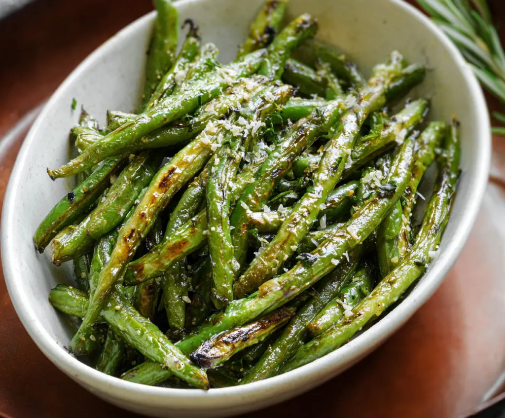 Delicious roasted green beans with a crispy, caramelized exterior and vibrant green color.
