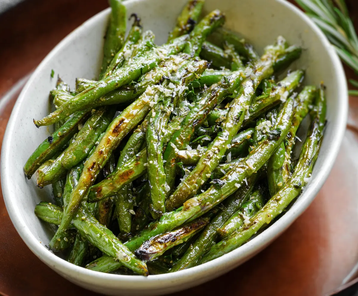 Delicious roasted green beans with a crispy, caramelized exterior and vibrant green color.