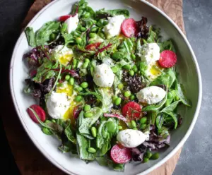 Fresh spring salad with goat cheese, mixed greens, cherry tomatoes, and a light vinaigrette.